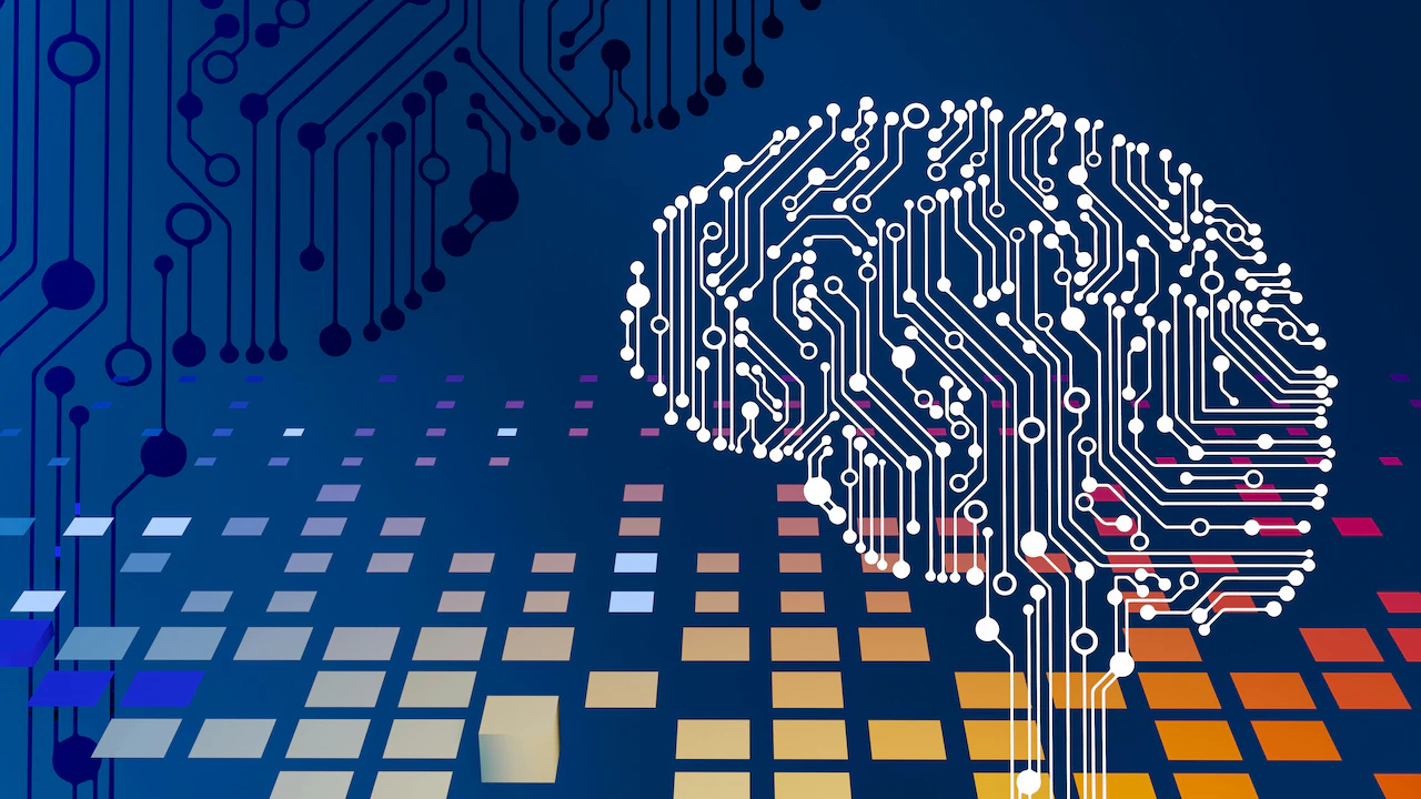 Brain made of white circuit-board lines on a dark blue background with colorful tiles
