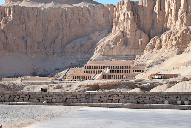 The Temple of Hatshepsut in Luxor, a breathtaking monument of ancient Egyptian architecture, seamlessly blending with the dramatic cliffs of Deir el-Bahari.